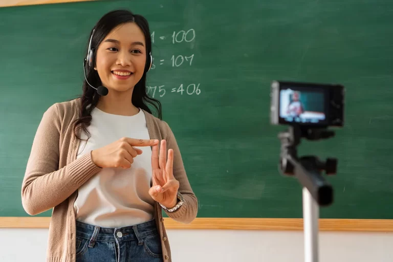 Female teacher recording video in classroom